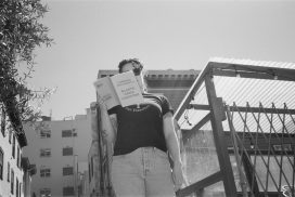 Caitlyn Skye Wild reads at Ferlinghetti's olive tree, planted in 2019 to honor his 100th birthday