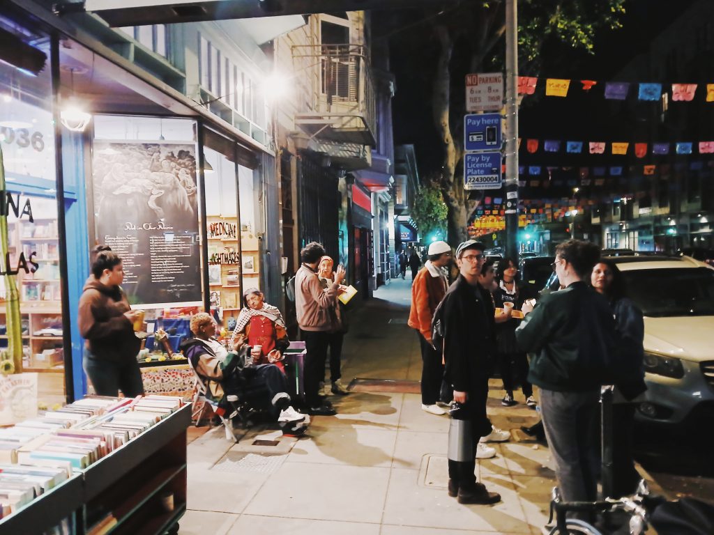 People gather outside of Medicine for Nightmares at the bookstore's third anniversary celebration.